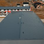 New tin roof on the apartment building. Watterproof roofing system