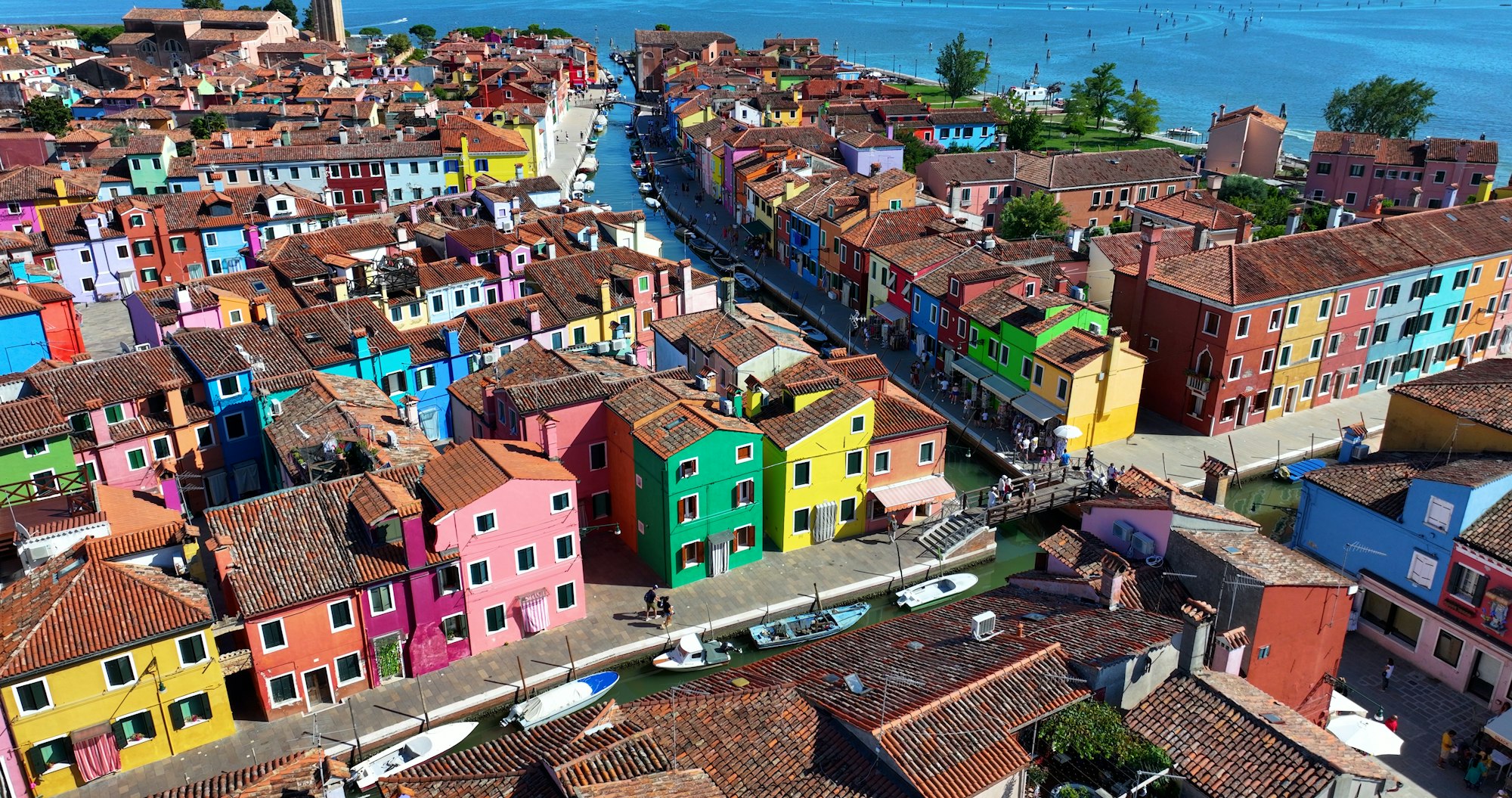 Vibrant facades of Burano, scenic canals and fishing town charm near Venice